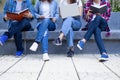 A group of high school students are studying together in the university. A gang of friends uses books, computers, tablets to learn Royalty Free Stock Photo