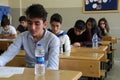 Group of high school students taking a test in classroom. Royalty Free Stock Photo