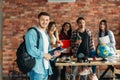 Group of highschool students with textbooks, team