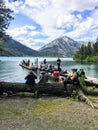 A group of hiker friends hanging out by the shores of Waterton Lake