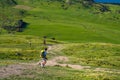 A group of hiker hiking on the beautiful track with a landscape of the mountains and Lake Wanaka. Roys Peak Track, South Island,