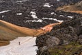 Group of hiker trekking on Landmannalaugar trail with volcanic lava during summer at Highlands of Iceland