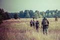 A group of hikers with backpacks travel through Chernobyl zone