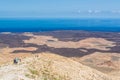 Group of hikers on Caldera Blanca, old volcano in Lanzarote, Canary islands, Spain Royalty Free Stock Photo