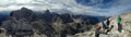 Group of hikers enjoy the scenic panorama in the Julian Alps in Slovenia in July 2017