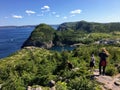 A group of hikers explore the rugged coasts of Newfoundland outside of St. John`s Royalty Free Stock Photo