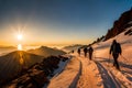 A group of hikers framed by the golden hues of a setting sun as they ascend a mountain ridge, casting long shadows