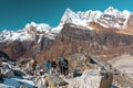 Group of Hikers and Nepalese Porter carrying many camping luggage Royalty Free Stock Photo