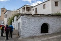 Group of hikers next to the public laundry of Ferreirola