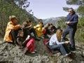 Group of hikers resting in nature Royalty Free Stock Photo