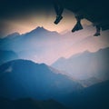 Group of hikers sit above the mountain. Instagram stylisation Royalty Free Stock Photo