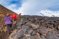 Group of hikers walking on a mountain, Kamchatka, Russia.