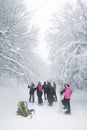 Group Hikers Walking On Trail Snow Covered And Foggy