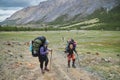 Group hiking, multi-day backpacking. Hiking in the Altai mountains, amazing landscape of the valley of the mountain range. Russia