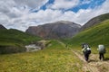 Group hiking, multi-day backpacking. Hiking in the Altai mountains, amazing landscape of the valley of the mountain range. Russia