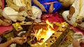 Group of Hindu practitioners performing homa fire ritual during the ceremony of prana pratishta, which takes place at the innaugu