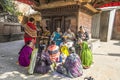 A group of Hindu women devotees in colorful sarees chanting prayers inside the Kathmandu Durbar Square Royalty Free Stock Photo