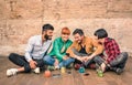 Group of hipster best friends with smartphones in grungy place Royalty Free Stock Photo