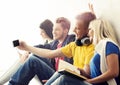 Group of hipsters taking a selfie on a break Royalty Free Stock Photo