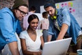 Group of hipsters using a computer