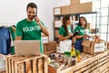 Group of hispanic volunteers working at charity center Royalty Free Stock Photo