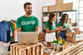 Group of hispanic volunteers working at charity center Royalty Free Stock Photo