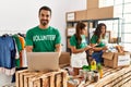 Group of hispanic volunteers working at charity center Royalty Free Stock Photo