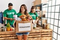 Group of hispanic volunteers working at charity center Royalty Free Stock Photo