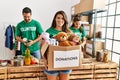 Group of hispanic volunteers working at charity center Royalty Free Stock Photo