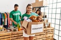 Group of hispanic volunteers working at charity center Royalty Free Stock Photo