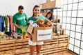 Group of hispanic volunteers working at charity center Royalty Free Stock Photo