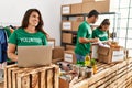 Group of hispanic volunteers working at charity center Royalty Free Stock Photo