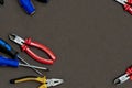 Group home repair master screwdriver black yellow pliers set of screwdrivers copy dpace on dark background mockup
