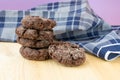 Group of homemade choco cookies on wooden table with dark blue towel Royalty Free Stock Photo