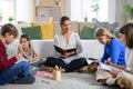 Group of homeschooling children with teacher studying indoors, coronavirus concept. Royalty Free Stock Photo