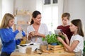 Group of homeschooling children with teacher planting herbs indoors, coronavirus concept. Royalty Free Stock Photo