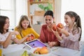 Group of homeschooling children with teacher studying indoors, coronavirus concept. Royalty Free Stock Photo