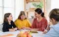 Group of homeschooling children with teacher studying indoors, coronavirus concept. Royalty Free Stock Photo