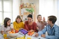 Group of homeschooling children with teacher studying indoors, coronavirus concept. Royalty Free Stock Photo