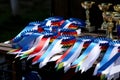 Closeup of colorful ribbons awards rosettes and trophys for winners In equitation competition Royalty Free Stock Photo