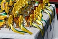 Group of horse riding equestrian sport trophys badges rosettes at equestrian event at summertime