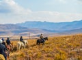 Group of Horseback riders on a trail in Drakensberg mountains Royalty Free Stock Photo