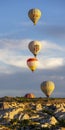 Group of hot air balloons fly near Goreme at sunrise Royalty Free Stock Photo