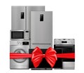 Group of household appliances with red gift ribbon and bow. Refrigerator, microwave, TV, washing machine, gas stove isolated on