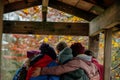 group huddled under playhouse roof