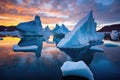 group of icebergs under midnight sun