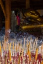Group incense with candle and statue background Royalty Free Stock Photo