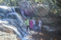 Group of Indian friends having fun in Waterfall in Royal Natal National Park South Africa