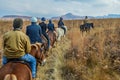 Group of Indian Horse riding riders on a trail in Drakensberg re