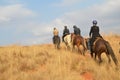 Group of Indian Horse riding riders on a trail in Drakensberg region in South Africa